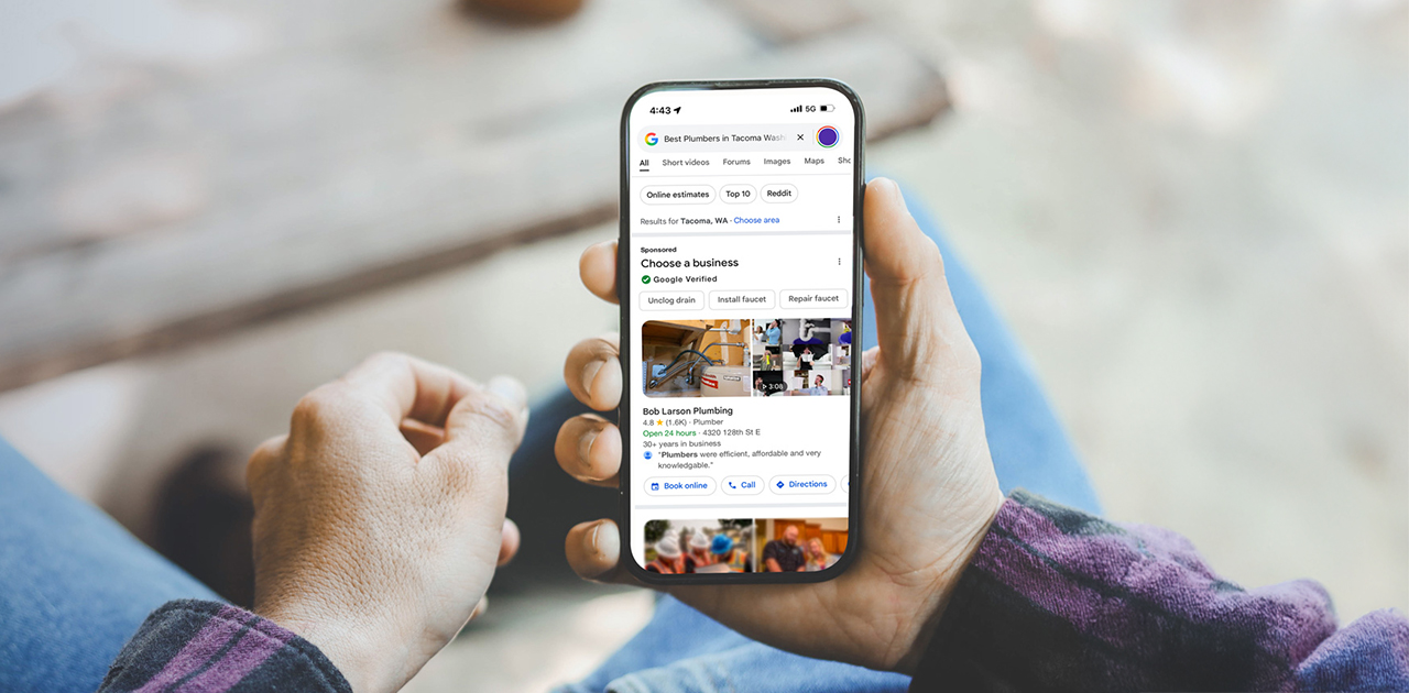 a hand holding a cell phone