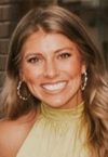 a woman smiling for the camera