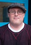 a man wearing a hat and glasses