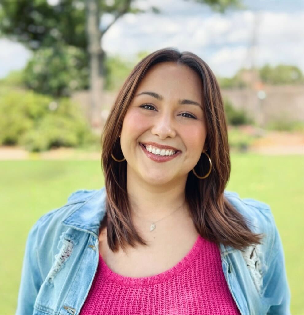 a woman smiling for the camera