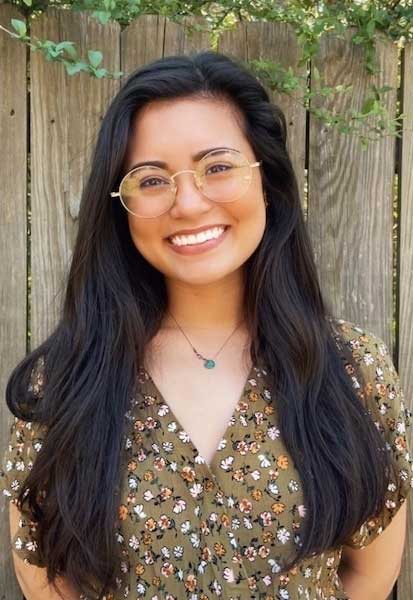 a woman smiling for the camera