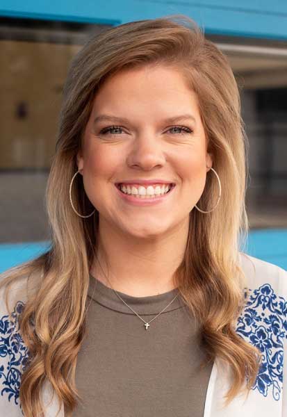 a woman smiling for the camera