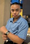 a young man in a blue shirt